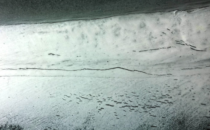 Detail of Magnetic Particle Testing on a surface crack