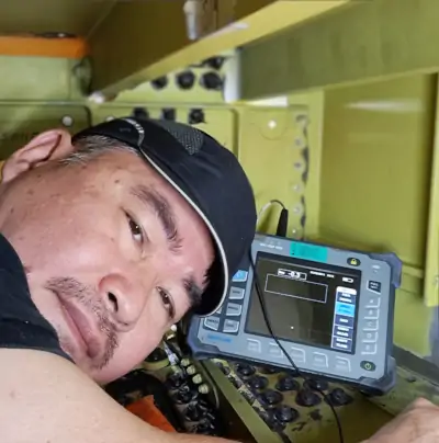 Leong Chee Hon performing an NDT inspection in a maintenance hole