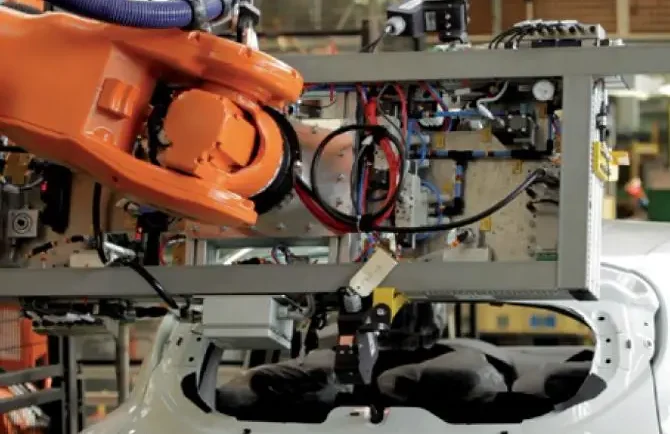 Robot Guide installed as a rack on a robot arm inspection a car body in the production line