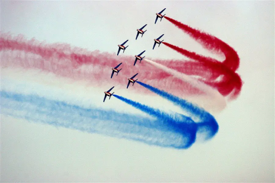 Patrol of 8 military airplanes, painting a French flag into the sky
